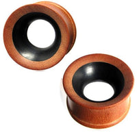 Load image into Gallery viewer, Zwei handgeschnitzte Tunnel zweifarbig braun schwarz aus Teakholz/Eisenholz mit schwarzen Innentunneln (Tribal Plug Expander) sind vor weißem Hintergrund zu sehen.
