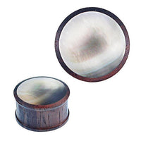 Cargar imagen en el visor de la galería, The Sonoholz Plug Black Shell Perlmutt Inlay schillernd Tunnel Tribal Expander Ohrplug, a round tribal plug with an iridescent inlay, is shown from the side and top view against a white background.
