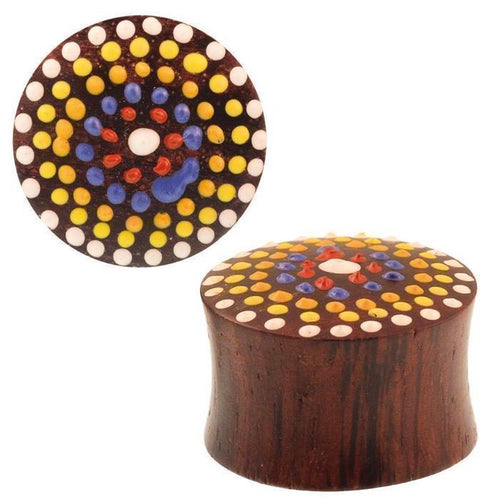 A hand-painted Sonoholz Plug (Tupfen Blume rot gelb bunt) with a flared end, featuring a colorful mandala dot flower design in red, yellow, blue, and white on the front. Ideal as an expander tunnel with tribal style.