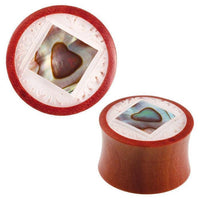 Load image into Gallery viewer, The Organic Sabaholz Plug Paua Abalone eckig gerahmt Perlmutt Tunnel Tribal Expander features a round wooden design with a square Paua Abalone inlay, heart center, and intricate white carved detailing on the slightly flared edge.
