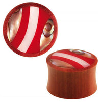 Cargar imagen en el visor de la galería, Two round Saba Holz Plug Muschel Inlay Streifen Rot weiß Expander Tunnel plugs feature red, white, and abalone inlaid stripes on the flat ends, shown against a white background.
