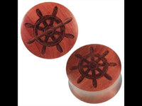 Load image into Gallery viewer, Two round, reddish-brown Rosenholz Plug braun feature a dark Schiffsruder engraving on their flat faces. Handgemacht and organic, these tribal-style plugs are both stylish and unique.
