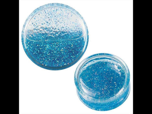 Two clear, round containers display Acryl Plug Flüssigkeit beweglich Glitzer türkis blau transparent Expander. The blue, glittery slime inside sparkles and looks soft and squishy. Both containers are photographed on a white background.