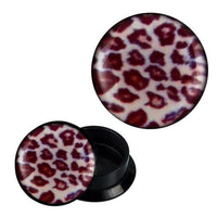 Load image into Gallery viewer, A pair of round black Schraub Plug Acryl Leo Muster weiß braun Expander Piercing Ohrschmuck, featuring a bold white and brown leo pattern on the flat front—one plug shown face up, the other with the screw-back opening visible.
