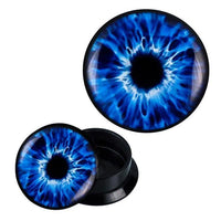 Load image into Gallery viewer, The Schraub Plug Acryl blau weißes Auge Pupille Piercing Ohrschmuck features round black acrylic ear plugs with a vivid blue and white eye design; one plug is shown from above and one open to display its hollow interior.
