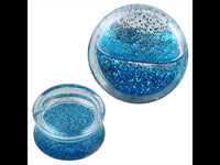 Load image into Gallery viewer, Two Plug Acryl transparent Piercing Ohrschmuck pieces, filled with blue liquid and Glitzer, shown from side and top views against a white background.
