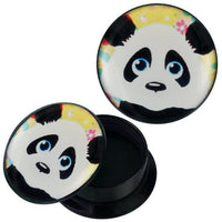 Load image into Gallery viewer, A round acrylic Schraub Plug Piercing/Ohrschmuck with a lid featuring a cartoon schwarz-weißer Panda face with blue eyes on a yellow background with colorful flowers. Lid is pictured both on and off the container.
