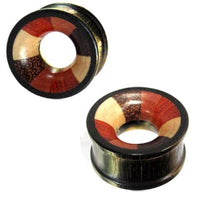 Load image into Gallery viewer, Pair of hand-carved vierfarbig Holztunnel Tribal Tunnel Plug Expanders for stretched ears, crafted from various woods with alternating brown, black, and reddish stripes and a large central hole.

