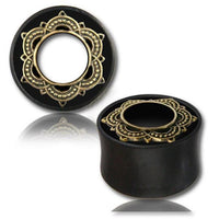 Cargar imagen en el visor de la galería, A pair of Holz Tunnel Eisenholz Lotus Brass Inlay golden handgeschnitzt Tribal Plug Expanders with ornate gold mandala designs, shown on a white background with a reflection underneath.
