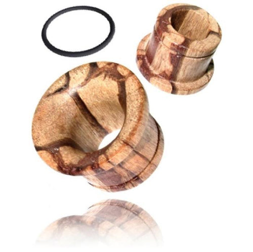 A hand-carved Holztunnel Tigerholz braun single flared plug with visible wood grain, tribal design, and black O-ring, showcased on a reflective white surface.