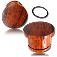 Load image into Gallery viewer, Two Flat Top Plug rötliches Holz single flared ear plugs with visible grain and a black Gummiring are shown on a white background, highlighting their natural Maserung and crafted Tribal style.
