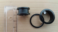 Load image into Gallery viewer, A clear plastic ruler is beside a disassembled Edelstahl Flesh Tunnel ribbed Plug schwarz Glitzer Zirkonia Stein Schraubplug with ring and screw on light wood. The Ohr Piercing diameter is about 2 centimeters.
