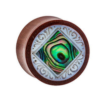 Load image into Gallery viewer, The Organic Sabaholz Plug features a rounded design with a diamond-shaped Paua Abalone Perlmutt inlay and detailed white tribal engravings, inspired by the &quot;Paua Abalone eckig gerahmt Perlmutt Tunnel Tribal Expander.
