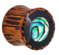 Load image into Gallery viewer, The Holz Plug Tunnel Kokosholz Resin Paua Abalone Kreise schillernd Tribal Expander features a dark Kokosholz tunnel, black rim, and shimmering Paua Abalone inlay at the center for a striking look.
