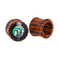 Load image into Gallery viewer, Two Tribal Holz Plug Tunnels: one displays a shiny Paua Abalone resin circle inlay, the other highlights the hollow center and textured brown Kokosholz surface with dark streaks.
