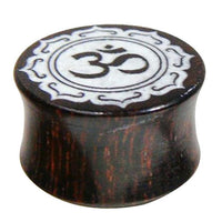 Load image into Gallery viewer, The Holz Plug Tamarinde Bone Inlay Om features dark wood with a white bone inlay of the Om symbol and an oriental carved border for a unique tribal look.
