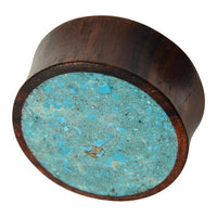 Cargar imagen en el visor de la galería, The Holz Plug Sonoholz Crushed Türkis Inlay double flared features a flat round face inlaid with crushed Türkis fragments, creating a bold speckled blue pattern on one end.
