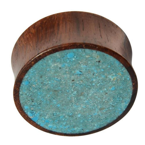 The Holz Plug Sonoholz Crushed Türkis Inlay double flared features a flat, circular face with inlaid crushed Türkis and a textured, speckled surface for a unique tribal expander look.