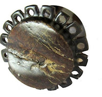 Load image into Gallery viewer, A round, dark brown Horn Plug Blumenform aus Rohhorn, double flared, features a stone-like cracked surface and a ring of evenly spaced holes around the edge, displayed against a white background.
