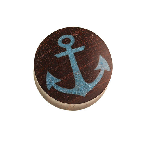 A round Holz Plug Anker made of dark brown Sonoholz, featuring a light blue crushed turquoise stone anchor inlay on top, set against a white background.