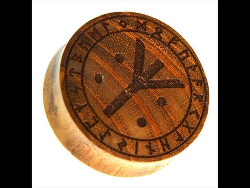 The Holz Plug Teakholz Rune Leben Tod Punkte double flared features a round wooden design with a bold central rune, surrounded by smaller runic symbols and dots on its flat surface.