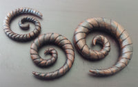Load image into Gallery viewer, Narraholz Piercing Holz Spiralgravur dunkelbraun Spirale 4mm 6mm 8mm Dehnspirale
