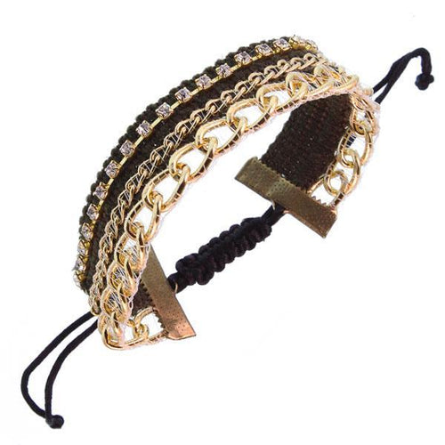 A wide Ibiza Hippie Style Damen Armband aus Kunstleder, Brass und Baumwolle in Gold, 30 cm lang. Features include a multistrand design with adjustable black woven closure and stylish dangling black cords.