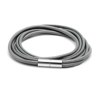 Load image into Gallery viewer, A triple-layer unisex Lederarmbänder in gray with a sleek silver Magnetverschluss, coiled circularly on a white background.
