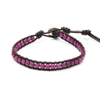 Load image into Gallery viewer, The Lederarmband “Achat gefärbt Perlen bunt Armband Leder verstellbar unisex” features round, colorful agate beads on brown leather with an adjustable fit.
