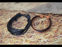 Load image into Gallery viewer, Leder Armband schwarz braun Schnüre verstellbar
