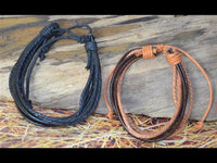 Load image into Gallery viewer, Leder Armband schwarz braun Schnüre verstellbar
