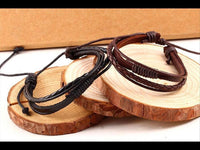 Load image into Gallery viewer, Leder Armband mehrreihig geflochten umwickelt verstellbar
