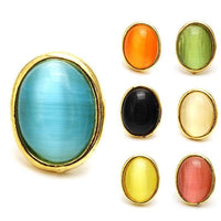 Cargar imagen en el visor de la galería, Seven colorful star-shaped unisex brass stud earrings, each in a different color—blue, orange, green, black, cream, yellow, and pink—displayed on a white background. Made of stainless steel and brass; 12 mm; nickelfrei for comfort.
