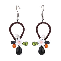 Load image into Gallery viewer, Brass Ohrringe silberfarben Tropfen umgedreht Stoff schwarz Perle Blume weiß
