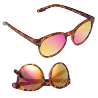 Load image into Gallery viewer, Two Sonnenbrille rund John Lennon sunglasses with Schlüssellochsteg and colorful mirrored lenses, one open and one folded. The Vintage 400UV shades reflect striking pink and yellow hues.
