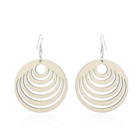 Load image into Gallery viewer, A pair of 50 mm round, colorful wooden earrings with semicircle cutouts hang from hooks, nickelfrei, displayed on a white background. These Organic Holzohrringe are ideal for women seeking unique and vibrant Ohrhänger.
