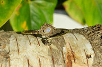 Load image into Gallery viewer, Messing Armreif antik golden Mondstein Maserung Schnörkel Herzen verstellbar
