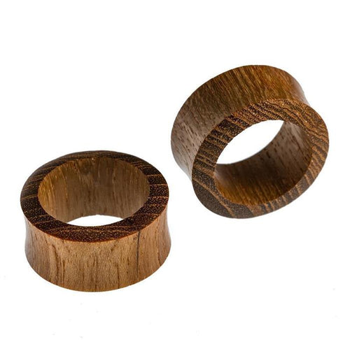 Two smooth, cylindrical Teakholz Flesh Tunnel braun double flared Plugs with a natural brown grain finish are displayed on a white background—one upright, the other lying flat.
