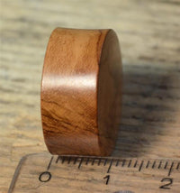 Load image into Gallery viewer, A round Flesh Plug Teakholz Vegvisir Runen Ring double flared stands upright on wood next to a transparent ruler marked in centimeters.
