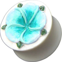 Cargar imagen en el visor de la galería, A Tribal Plug Bone in white, hand-carved, with a blue and green flower inlay—an Organic Expander Tunnel Piercing.

