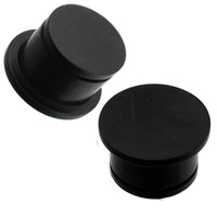 Load image into Gallery viewer, Two black, hand-carved Eisenholz Tribal Plug single flared tunnels with concave shape are shown against a white background.
