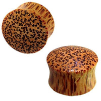 Load image into Gallery viewer, Two round, brown hell Holz Plug Punkte Muster Kokosholz handmade plugs with a textured, spotted pattern are shown against a white background.
