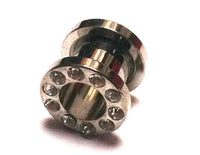 Load image into Gallery viewer, The Metall Tunnel Chirurgenstahl Strass Kristall Inlay Plug features a silbergrau circular front with Glitzerstein design and embedded clear crystals, ideal as a unisex expander and shown on a white background.
