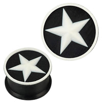 Cargar imagen en el visor de la galería, Two round Silikon Plug weich schwarz weiß with a raised edge, each featuring a white star design in the center. These stylish Piercing Ohrschmuck plugs are ideal as body jewelry or ear gauges.
