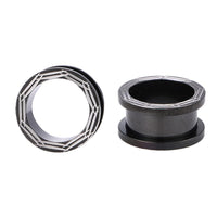 Load image into Gallery viewer, Two Chirurgenstahl Schraubplugs in black with silver line designs, one upright and one on its side, are displayed against a white background.
