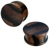 Load image into Gallery viewer, Two round Tigerholz Plug dunkelbraun schwarz Holzplug ribbed plugs with subtle lighter streaks, designed for stretched ear piercings, are displayed on a white background.
