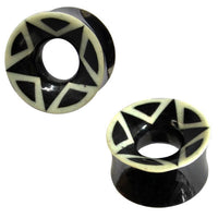 Cargar imagen en el visor de la galería, Two black and white Bio Stern Horn Plug Flesh Tunnels feature star-like geometric designs around the edges and a hollow center—ideal as organic expanders for a stylish, tribal-inspired piercing look.
