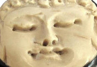 Load image into Gallery viewer, A close-up of a serene Buddha face carved on a cream surface, with closed eyes and calm features, resembling the Bio Horn Plug Buddha schwarz hell Flesh Tunnel Holz ornament.
