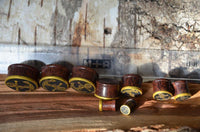 Load image into Gallery viewer, Plug Holz Tamarinde dunkelbraun Anker Seil Brass Überzug golden Rand Piercing
