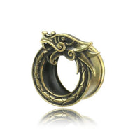 Load image into Gallery viewer, A brass tunnel earring in antique gold, shaped like the Viking Midgard Weltenschlange with detailed scales, displayed on a white background.
